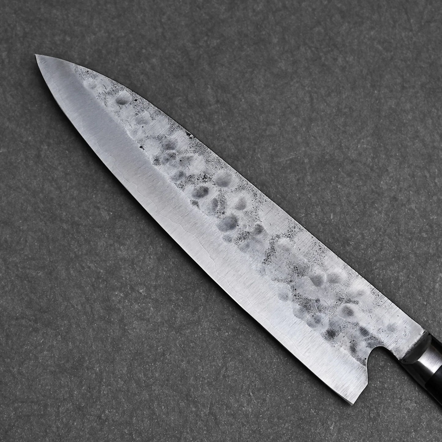 Close-up shot of the blade showing tsuchime finish on the back side