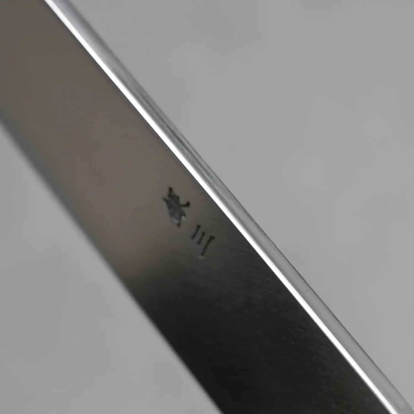 Close-up shot of the spine finish of the Tsunehisa kiritsuke yanagi