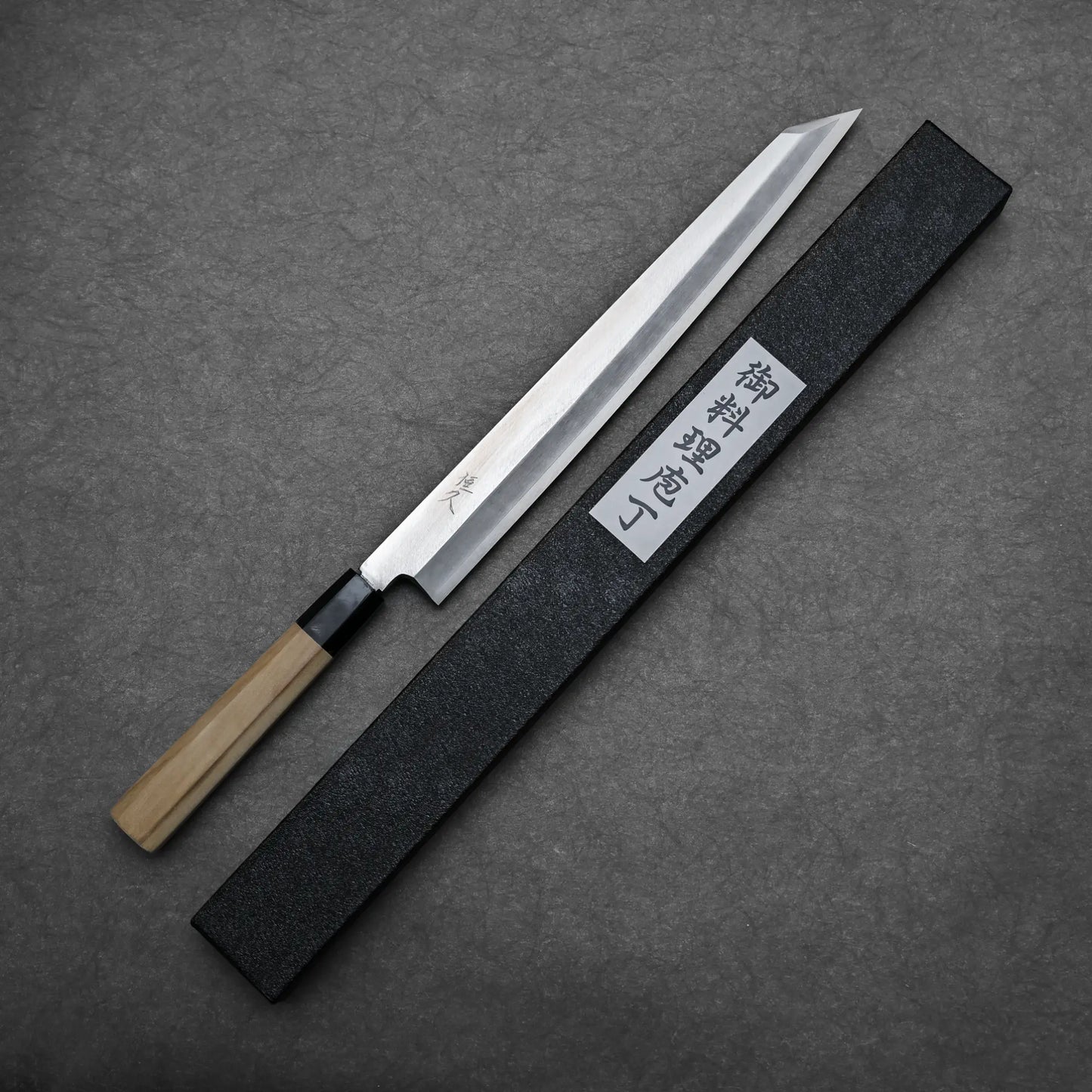 Full blade shape of the silver#3 ktip yanagi knife with its box beside it