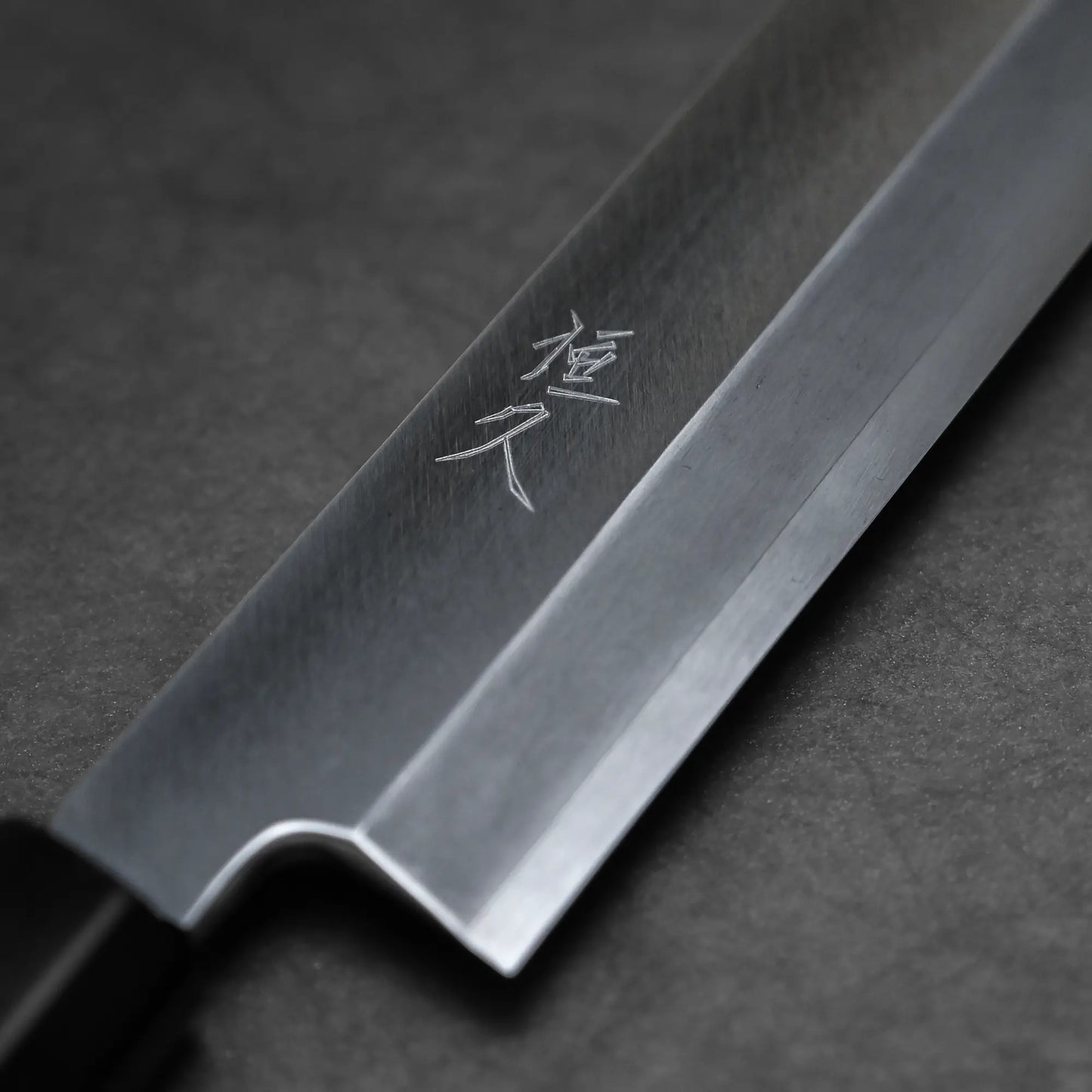 Close-up shot of the branding of ginsan kiritsuke yanagiba