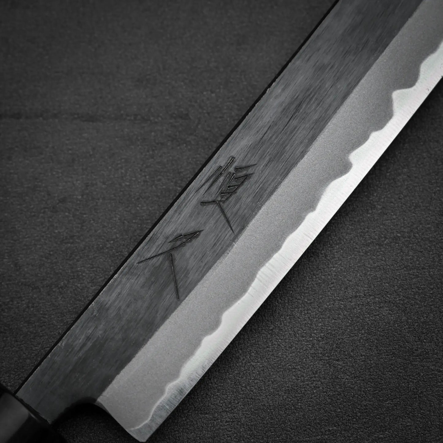 Close-up shot of the kanji of Tsunehisa knife kurouchi aogami#2 270mm sakimaru sujihiki