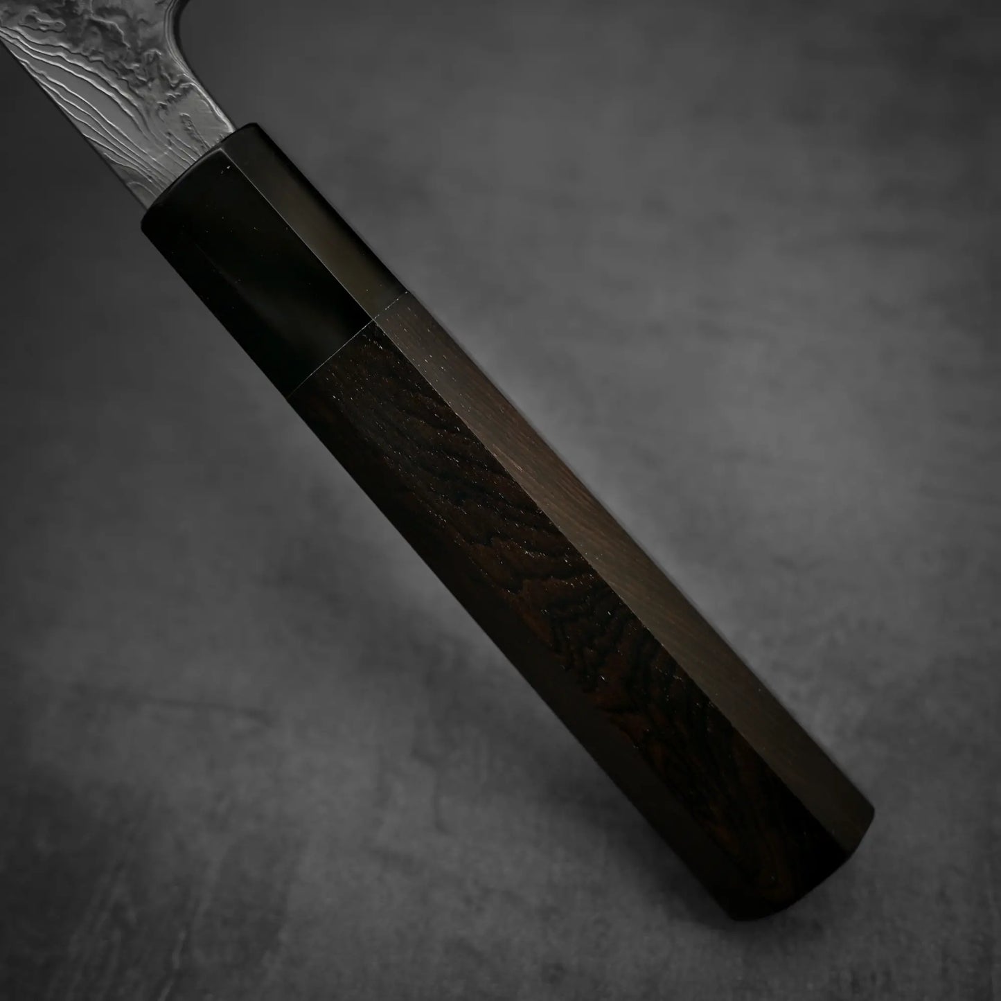 Close up view of the handle of Yoshihide Masuda shirogami#2 damascus tall gyuto knife