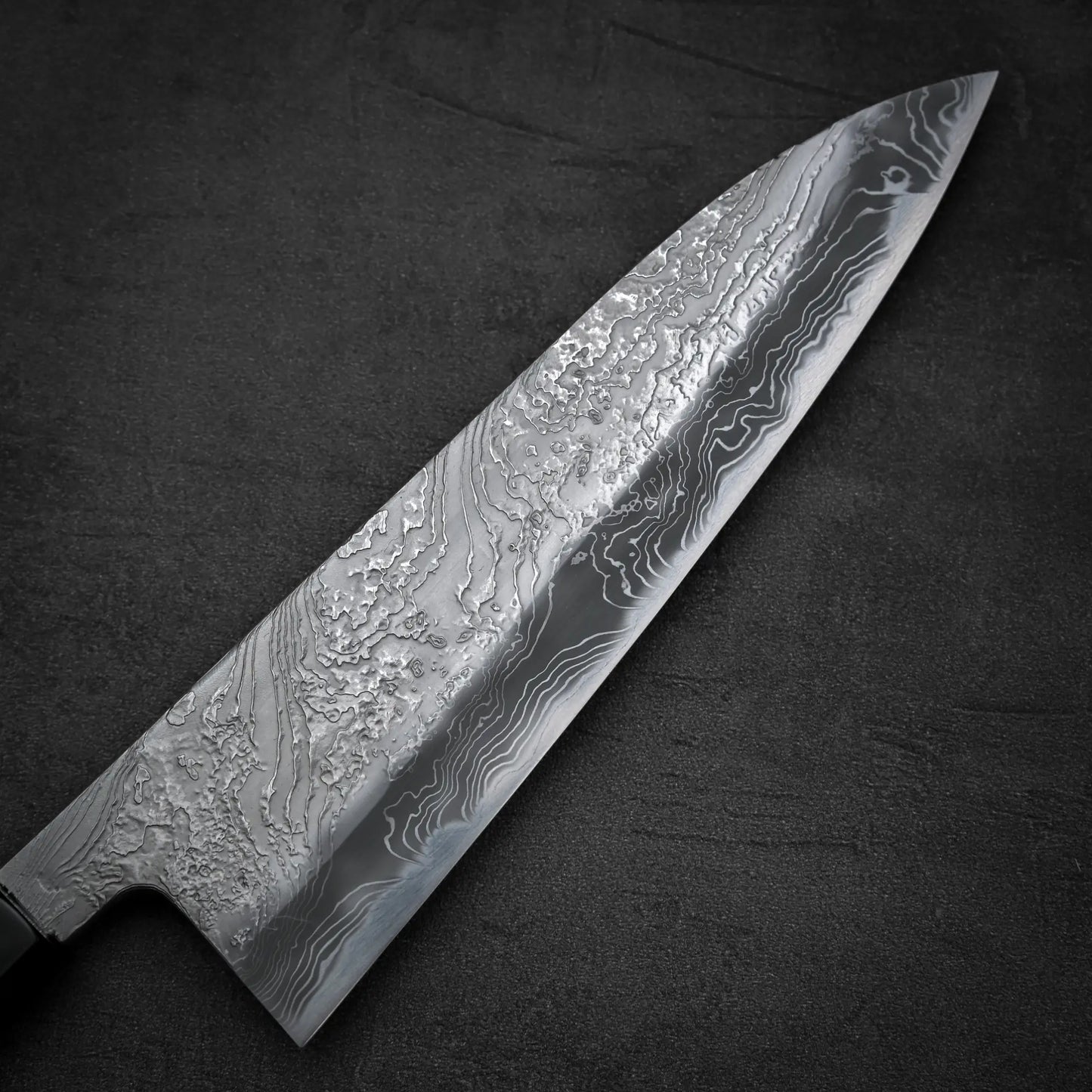 Close up view of the front blade of Yoshihide Masuda shirogami#2 damascus tall gyuto knife