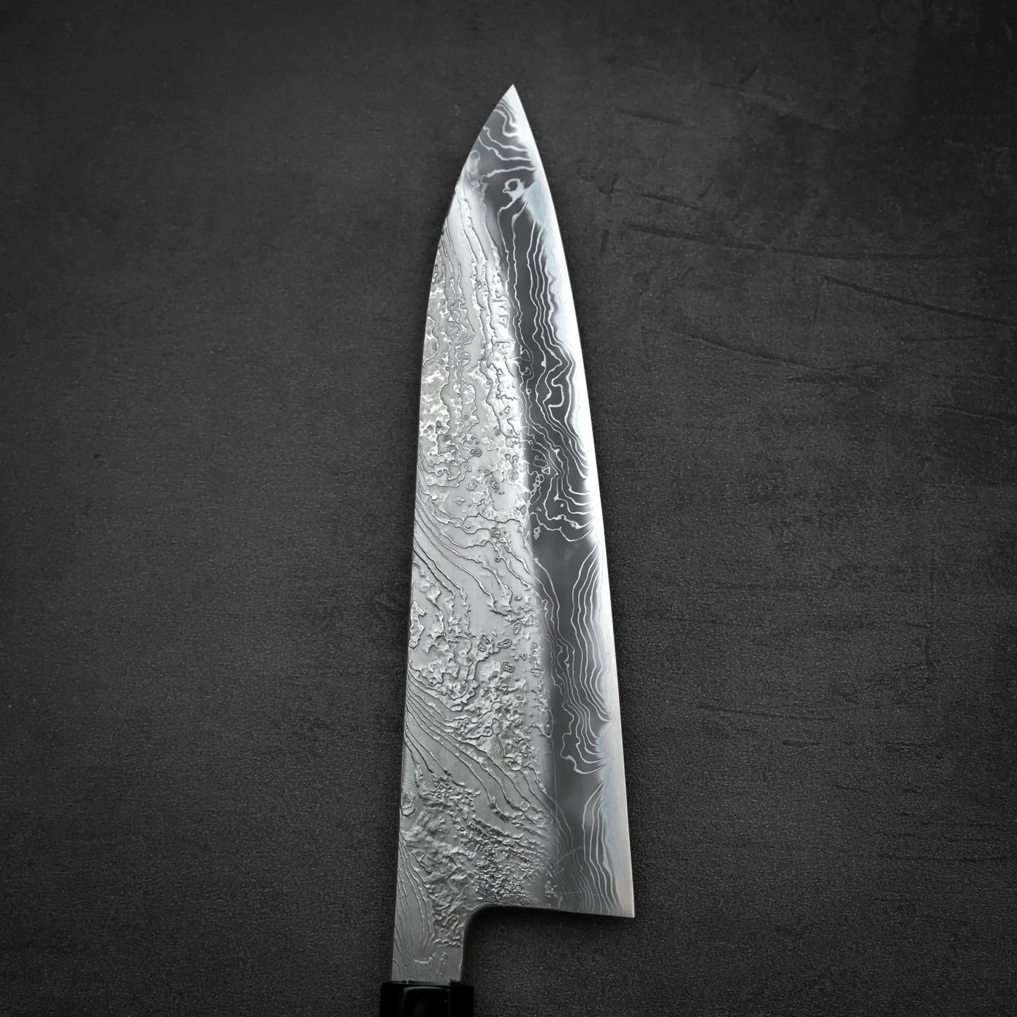 Close up view of the front blade of Yoshihide Masuda shirogami#2 damascus tall gyuto knife