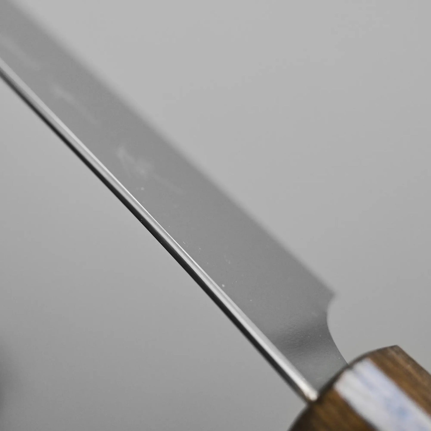 Close-up shot of the spine finish on the Kurosaki slicer