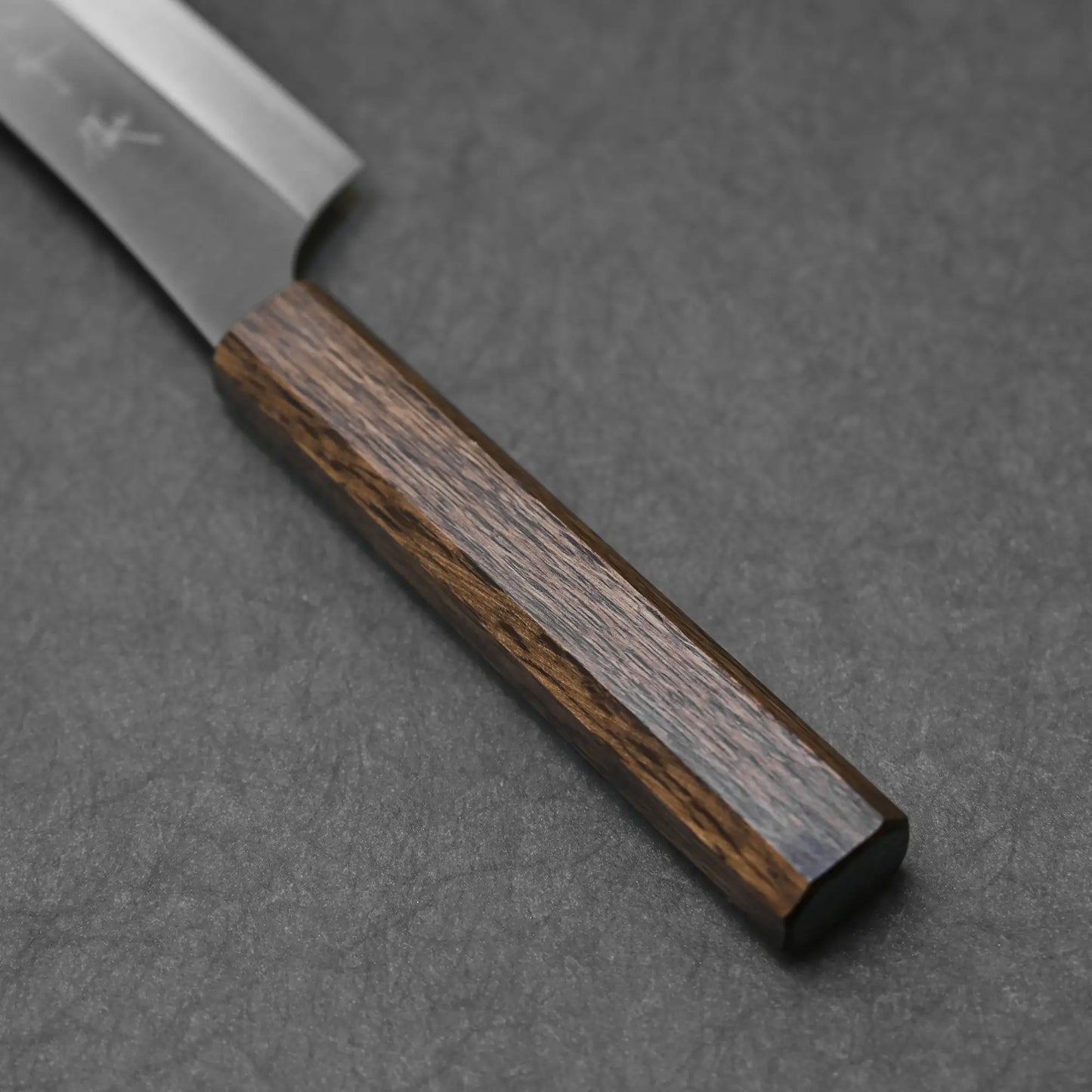 Close-up shot of the oak handle on the kitchen knife