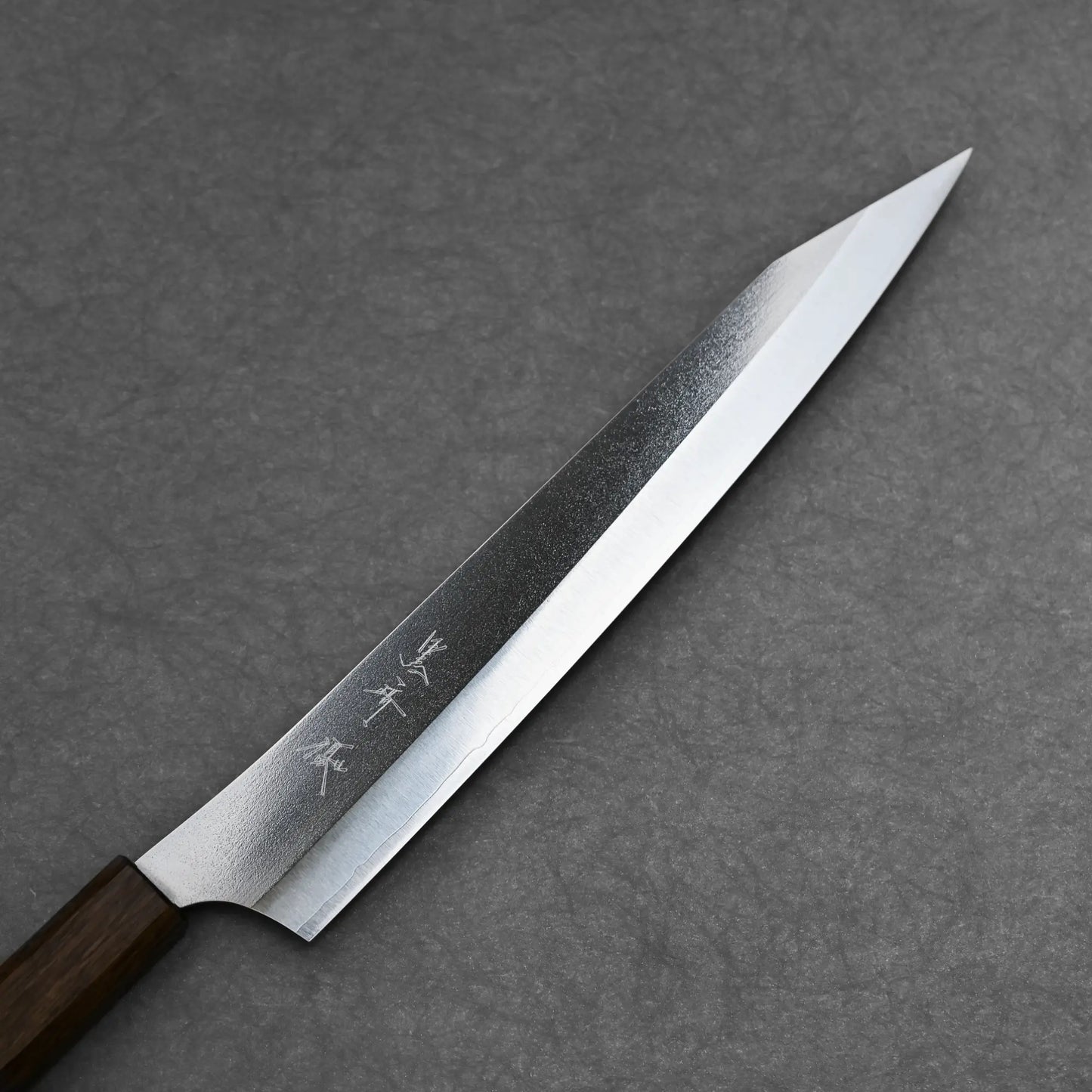 Close-up shot of the front blade showing the kanji and clean migaki finish