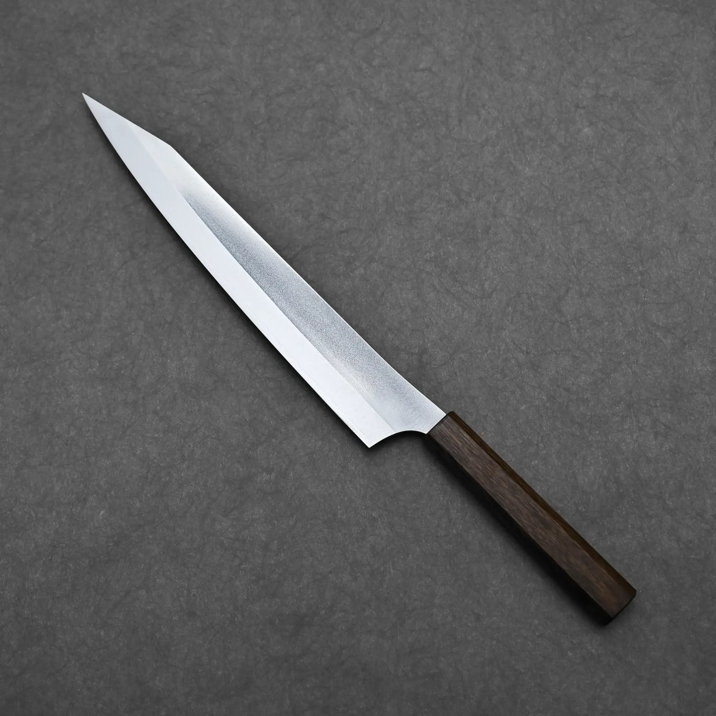 Angled view of the slicing knife showing the back side