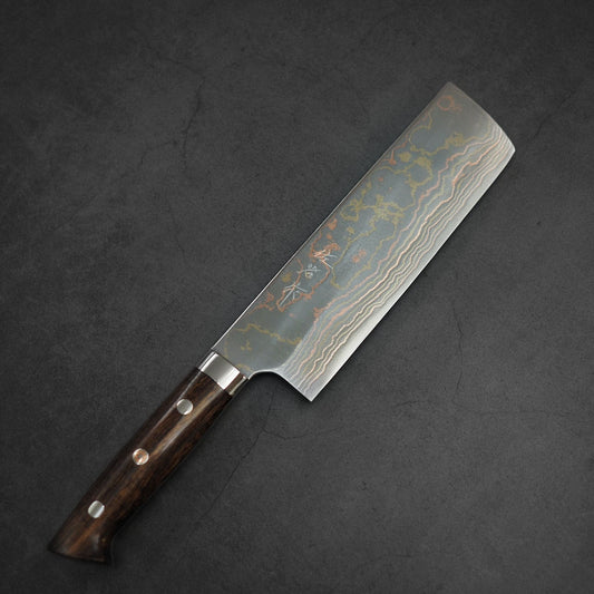 The Takeshi Saji rainbow damascus aogami#2 nakiri 170mm features a wavy patterned rectangular blade and a dark wooden handle, beautifully displayed on a dark gray textured surface.