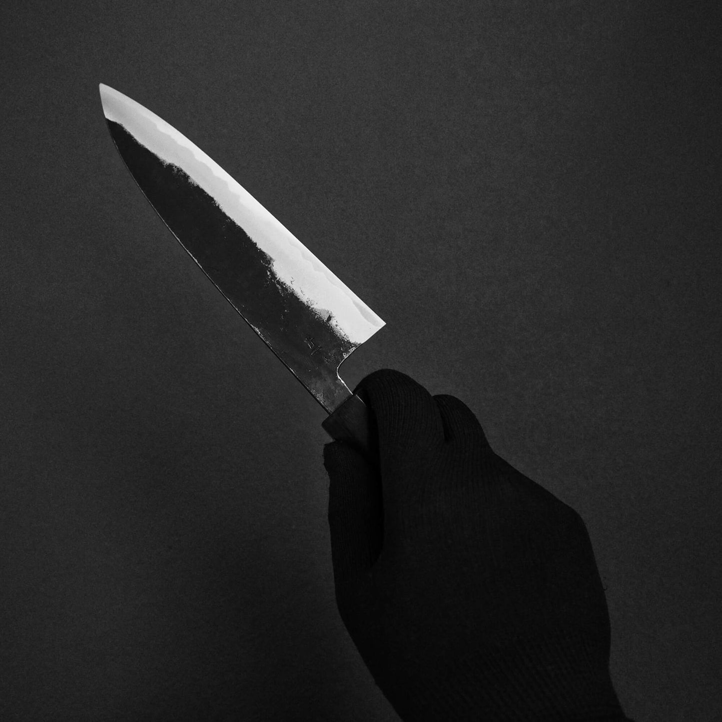 Hand holding Murata Buho kurouchi aogami#1 funayuki knife