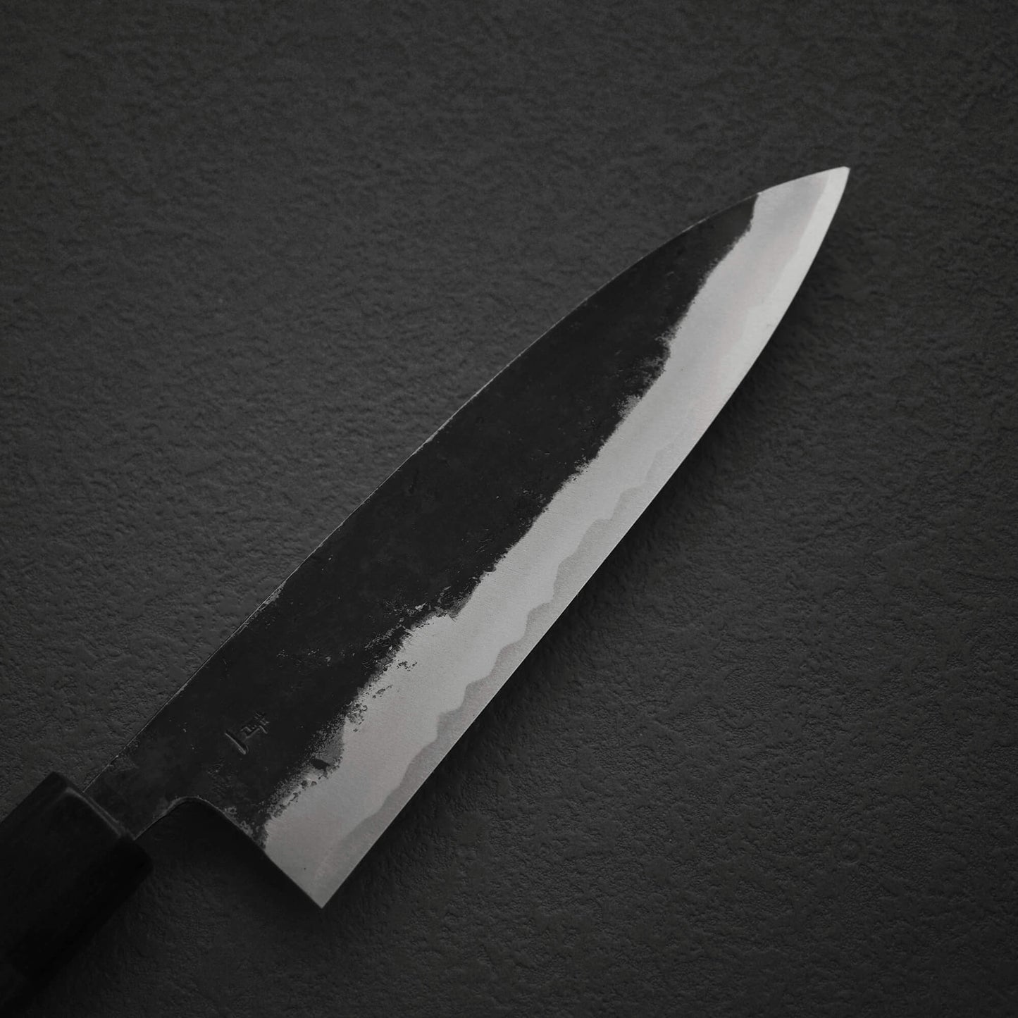 Top view of the blade of Murata Buho kurouchi aogami#1 funayuki knife. Image shows the right side of the blade.