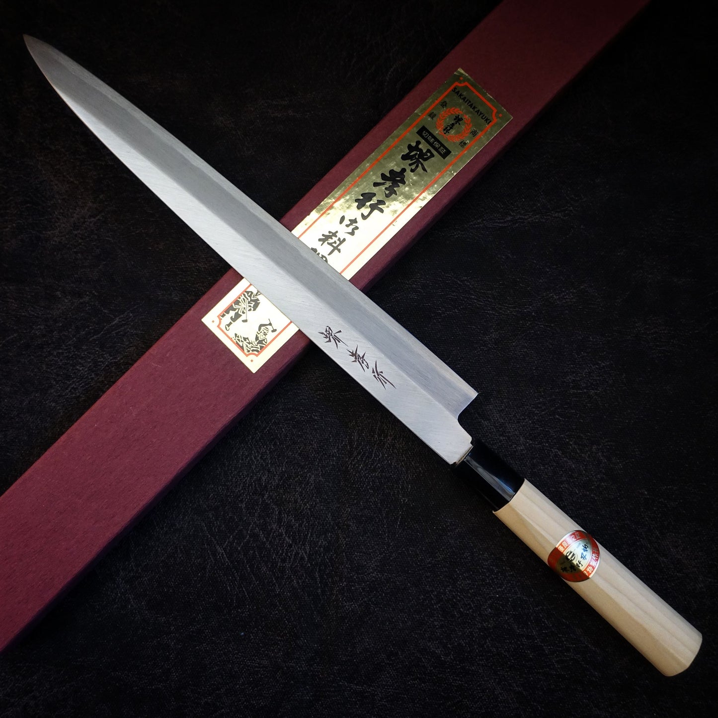 Sakai Takayuki shirogami#3 300mm yanagiba on top of box