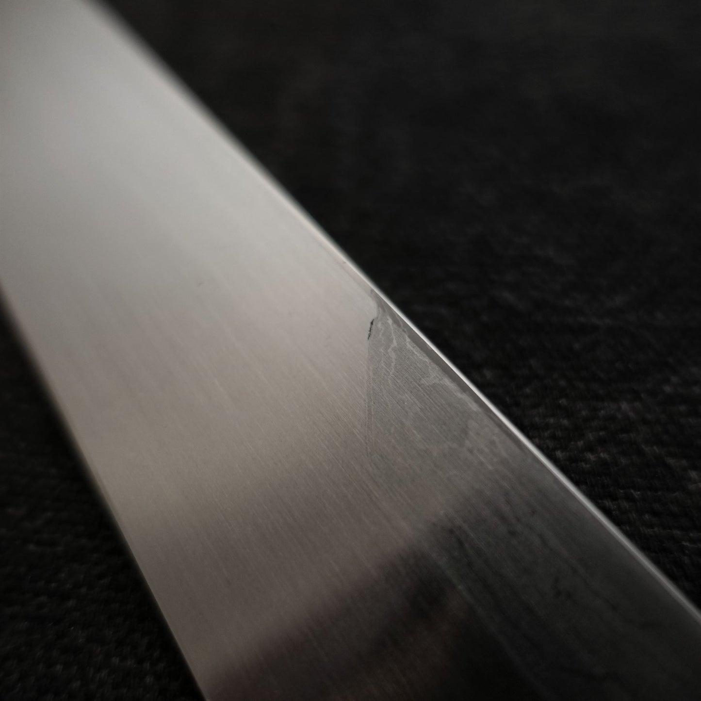 Close-up view of 330mm kitaeji yanagiba Shigefusa knife showing urasuki