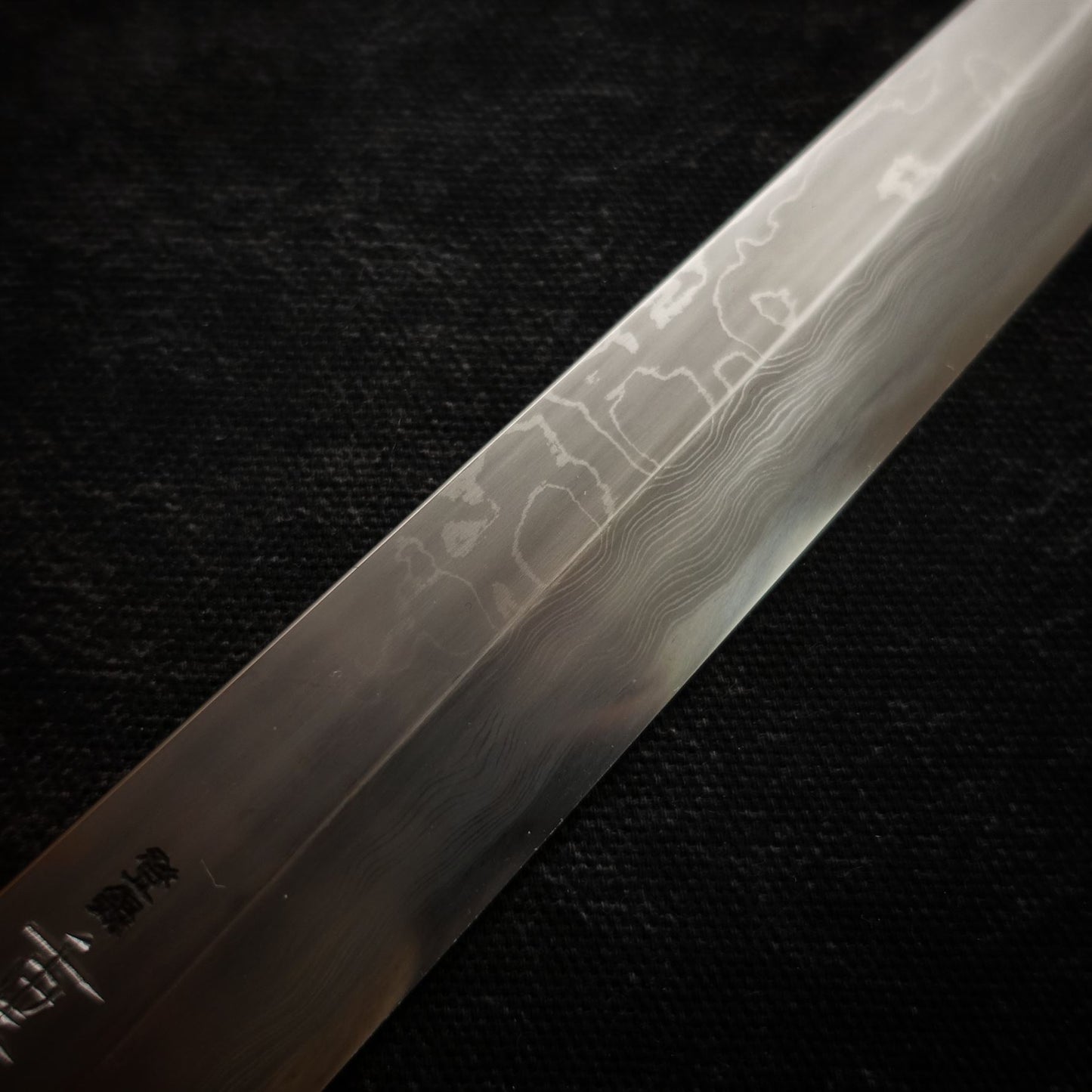 Close-up view of 330mm kitaeji yanagiba Shigefusa knife showing kitaeji finish