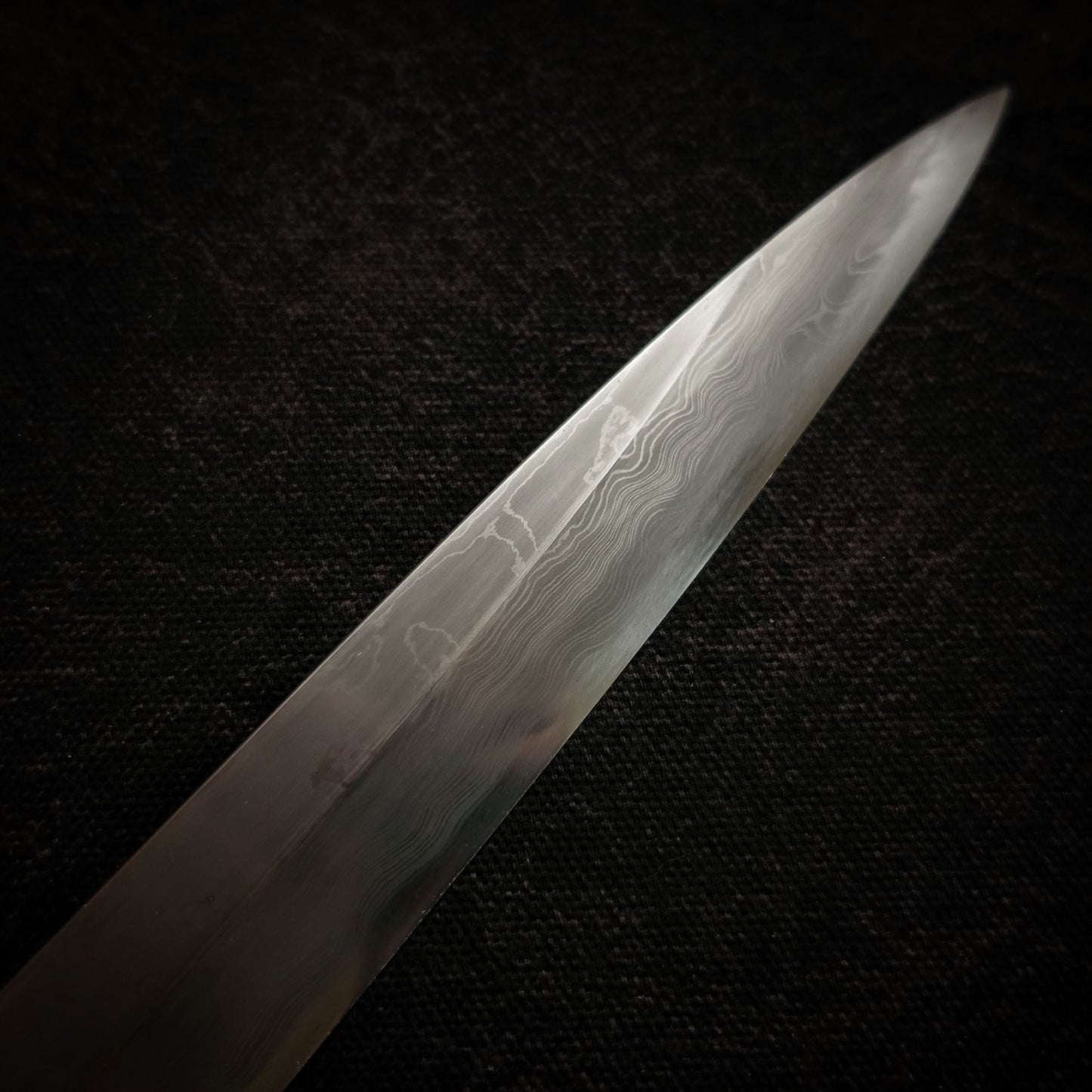 Close-up view of 330mm kitaeji yanagiba Shigefusa knife showing tip area
