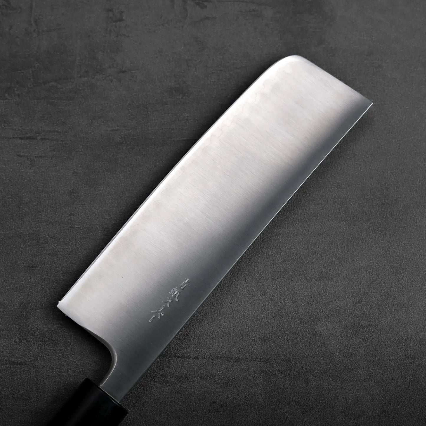 Nakiri with a straight blade, positioned to showcase its broad profile and clean lines.