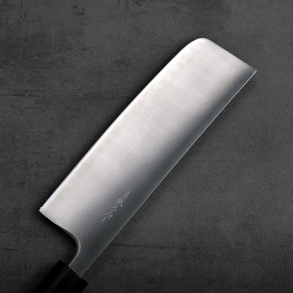 Nakiri with a straight blade, positioned to showcase its broad profile and clean lines.