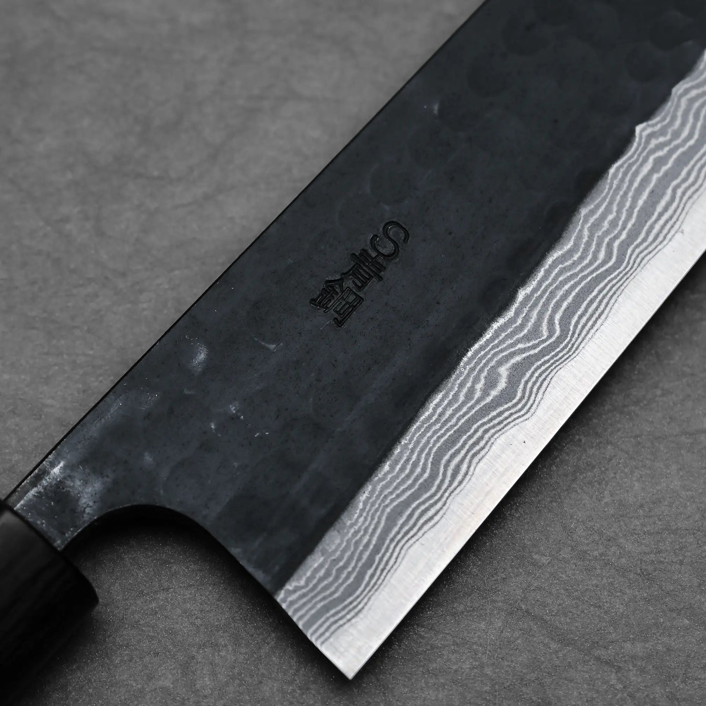 Close-up shot of the right side view of 240mm Akifusa x Yamamoto tsuchime kurouchi damascus AS gyuto knife