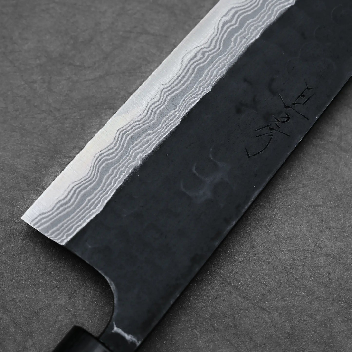 Close-up shot of the left side view of 240mm Akifusa x Yamamoto tsuchime kurouchi damascus AS gyuto knife