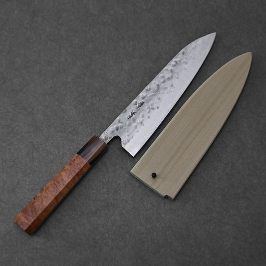 Gyuto with a magnolia saya and a wooden handle, featuring clean lines and smooth craftsmanship.