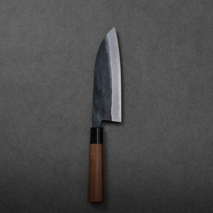 Close-up shows a dark blade and wooden handle of a Japanese knife; blade shape is not clearly visible.