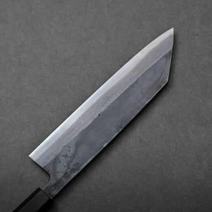 The back side of a kiritsuke gyuto with kurouchi finish
