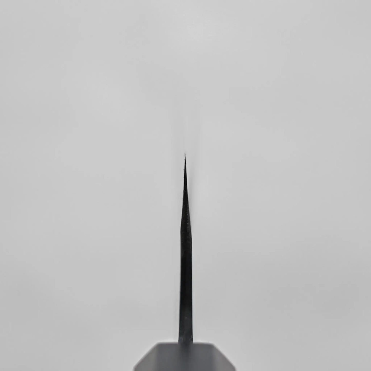 Close-up of a Japanese knife showing the choil shot