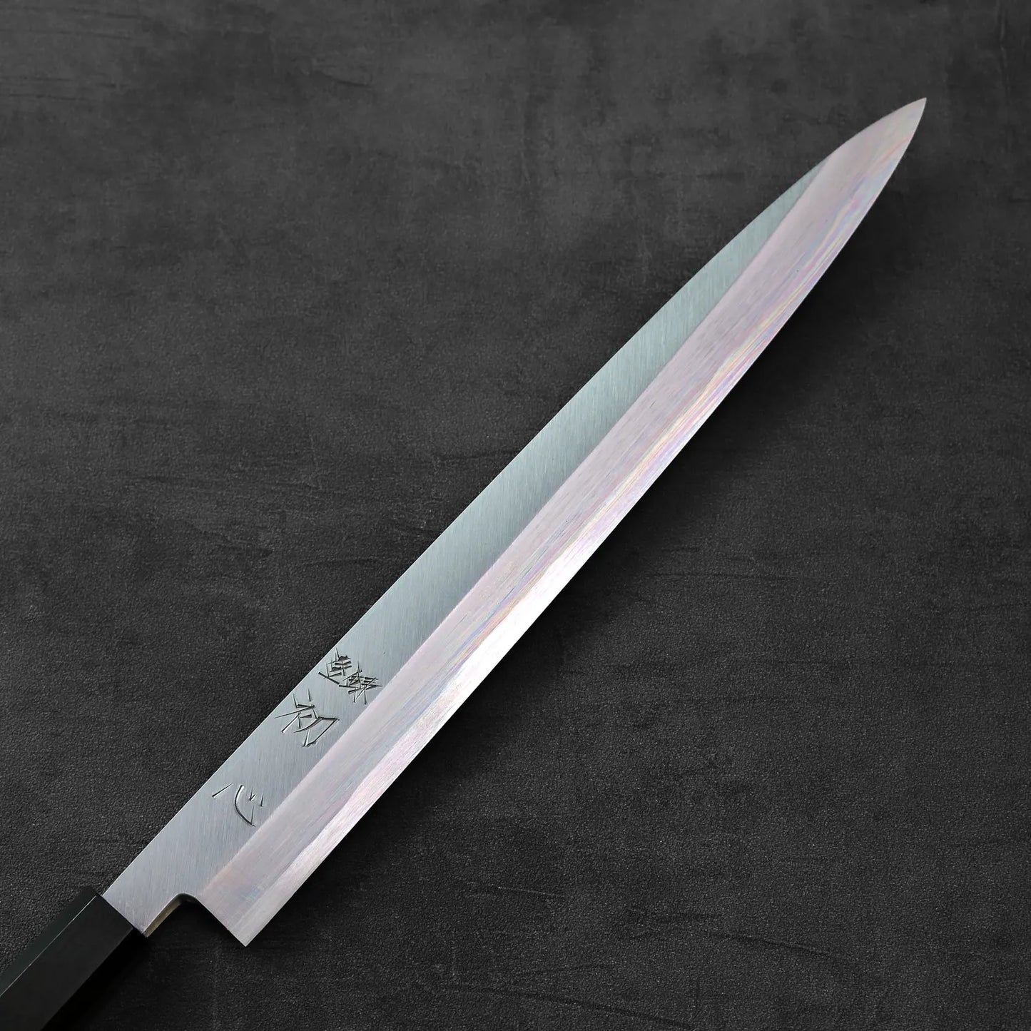 Yanagiba with a black handle, 300mm blade, featured with clear, minimal details visible.