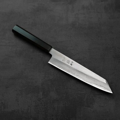Kiritsuke gyuto with a dark handle, showing clean lines and reflective finish.
