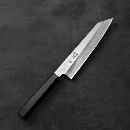 Hatsukokoro x Nakagawa ginsan kiritsuke gyuto 210mm with a black handle is shown, highlighting its distinct silhouette and smooth lines.