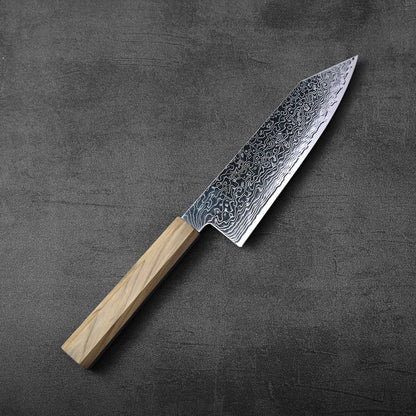 Bunka with a light wood handle displayed, showcasing detailed patterns along the blade’s surface.