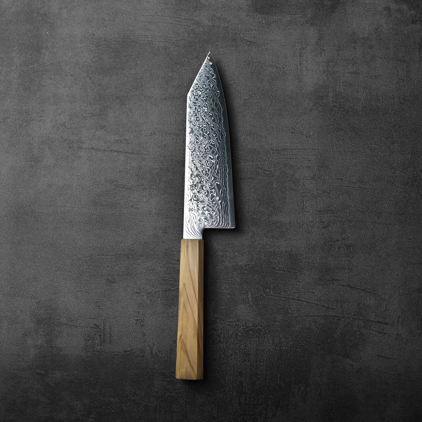 Bunka knife with a wooden handle, showcasing layered Damascus steel pattern throughout the blade.