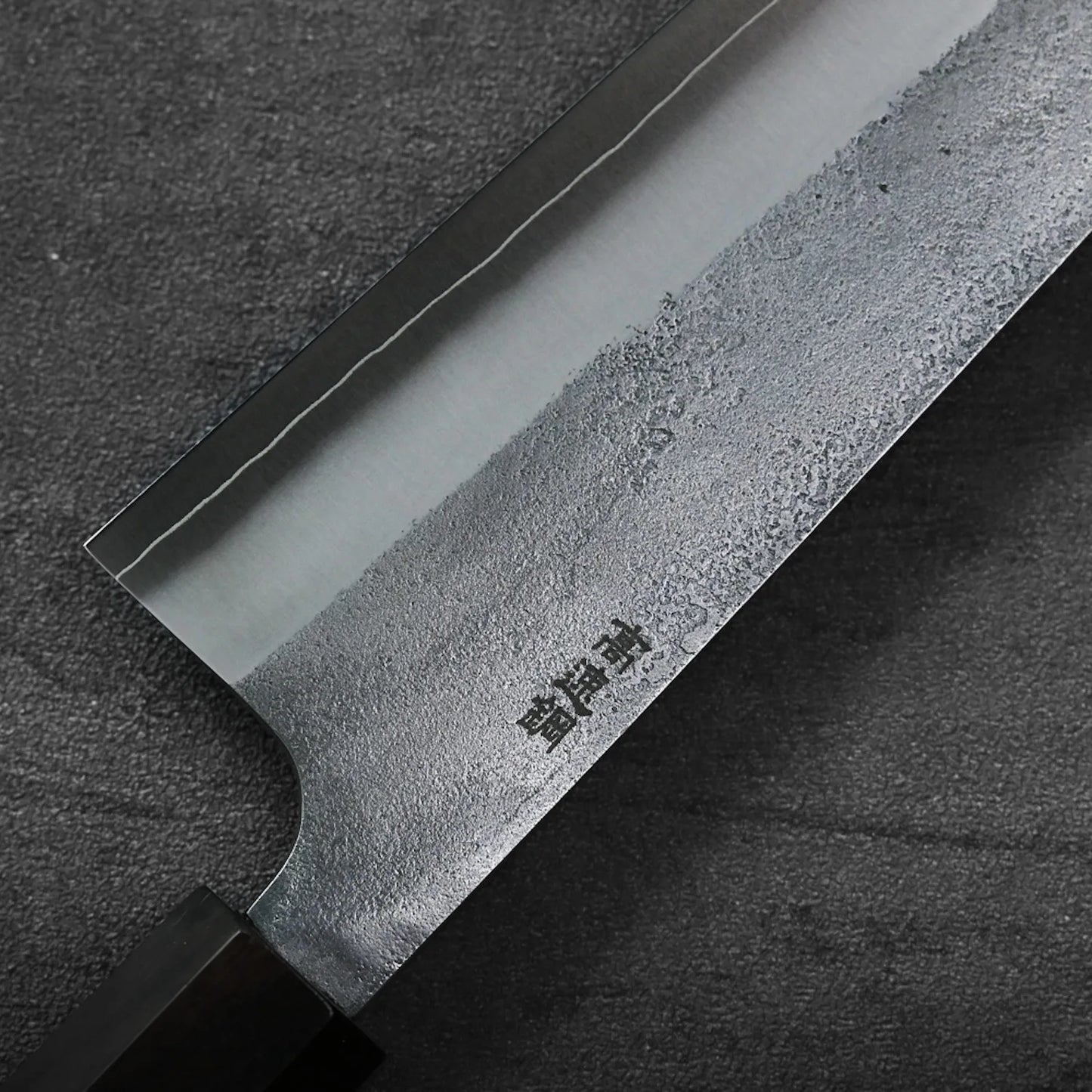 Gyuto with a nashiji finish, hand-forged in Sanjo, Japan, featuring visible kanji engravings on the blade.