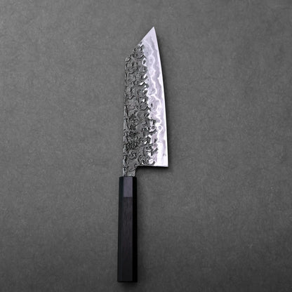 A patterned blade with an angular tip and dark handle on display; Japanese knife bunka type, Kisuke Manaka.
