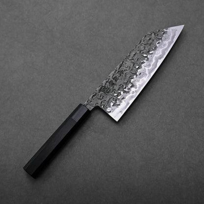 Close-up of a Kisuke Manaka ENN bunka 200mm patterned blade and dark handle, Japanese knife with bunka shape visible.