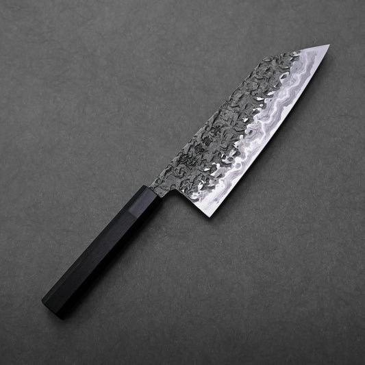 Close-up of a Kisuke Manaka ENN bunka 200mm patterned blade and dark handle, Japanese knife with bunka shape visible.