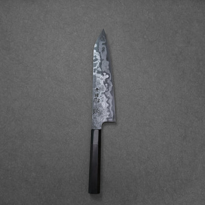 Japanese chef’s knife on a grey textured background, featuring a dark handle and Damascus steel blade with wavy forge patterns and prominent kanji engraving.