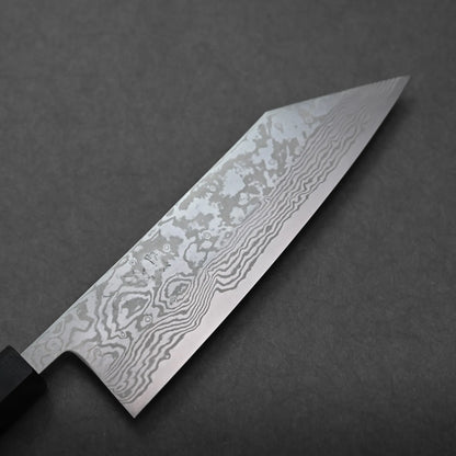 A close-up of a Miyazaki ATS34 knife blade with a visible Damascus steel pattern, featuring intricate, wavy lines and patterns on a dark gray background.