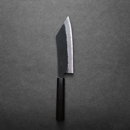 A single hakata knife with a dark wooden handle and a partially blackened, straight-edged blade is placed on a gray textured surface.