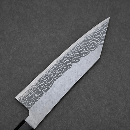 A close-up of the Nigara tsuchime damascus VG10 bunka 180mm chef’s knife blade, showcasing its intricate damascus pattern and wavy lines on VG10 steel, set against a dark gray textured background.