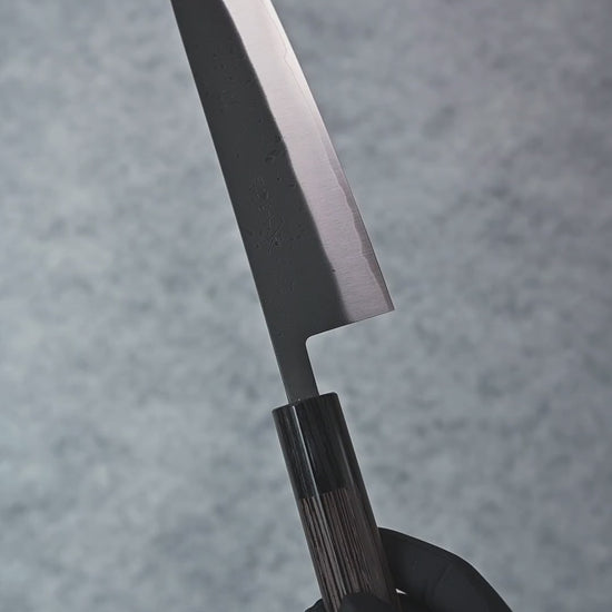 A detailed showcase video of the Ohishi Kurouchi SLD Gyuto 210mm, highlighting its dark kurouchi finish, finely honed edge, and ergonomic wenge handle from multiple perspectives