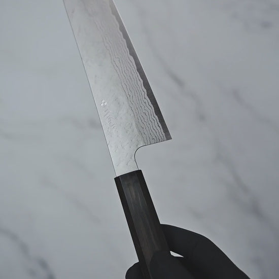 Short video showcasing a gyuto knife from Nigara hamono, rotating to display the blade, handle, and overall craftsmanship from multiple angles.