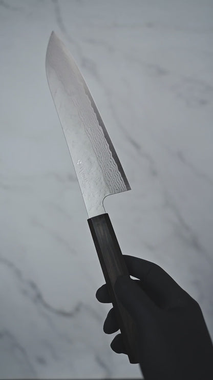 Short video showcasing a gyuto knife from Nigara hamono, rotating to display the blade, handle, and overall craftsmanship from multiple angles.