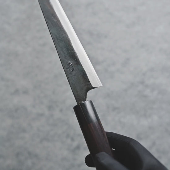 Video displaying Ohishi Kurouchi Aogami #1 Sujihiki 240mm against gray background. Shows multiple angles of this high-carbon Japanese chef's knife