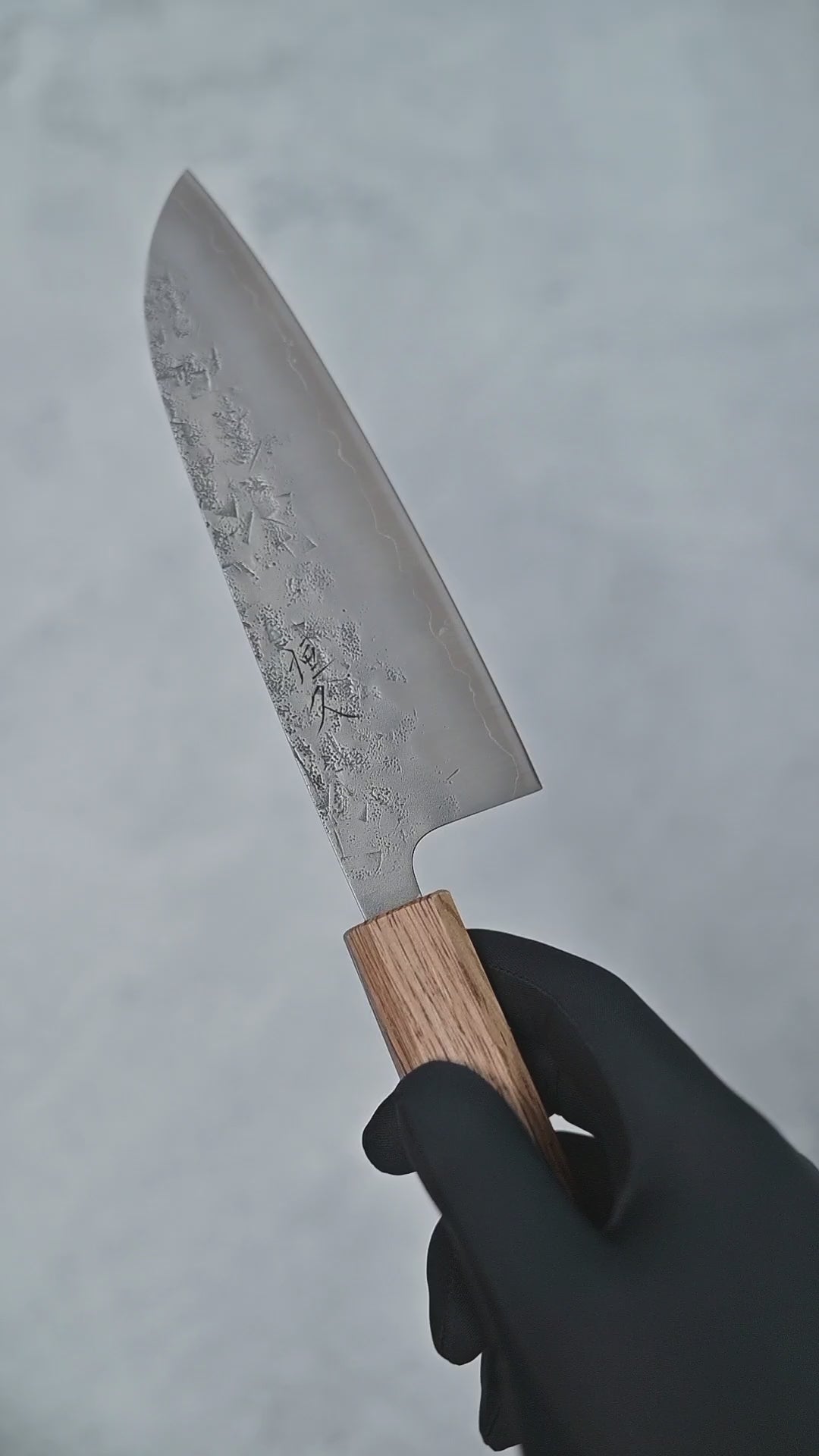 Video showing Tsunehisa nashiji SLD santoku knife from different angles with close-up views.