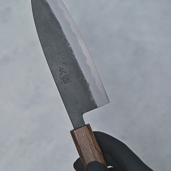 Video showing Hinokuni kurouchi shirogami1 santoku knife from different angles with close-up views.