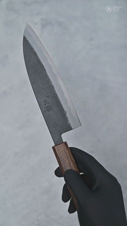 Video showing Hinokuni kurouchi shirogami1 santoku knife from different angles with close-up views.