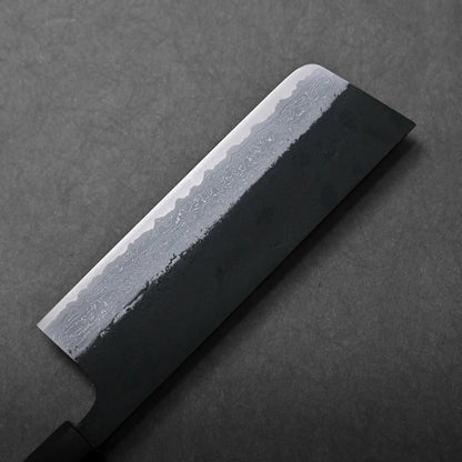 A close-up shows a Japanese knife with a dark handle and patterned blade; the blade shape is not fully visible.