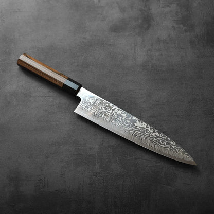Gyuto with a layered Damascus blade and wooden handle, displaying distinct steel patterns and wood grain.