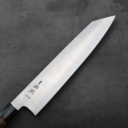 Kiritsuke gyuto with kanji engraved on the blade. The handle and blade are clearly visible in the image.